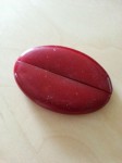 red oval squeeze purse